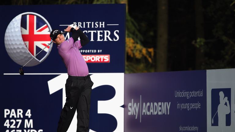 Marc Warren of Scotland hits his tee-shot on the 13th hole during the first round of the British Masters supported by Sky Sports