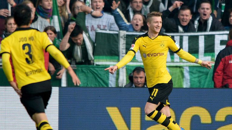 BREMEN, GERMANY - OCTOBER 31:  Marco Reus (R) of Dortmund celebrates after scoring the opening goal 