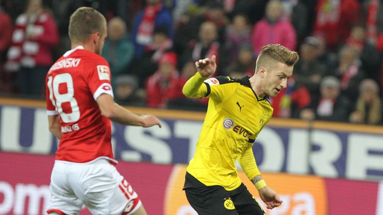 Dortmund's striker Marco Reus (R) scores the 0-1 during the German first division Bundesliga football match FSV 