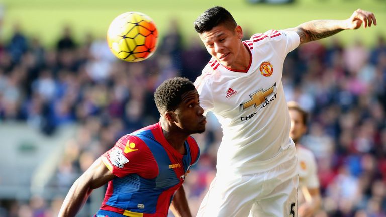 Marcos Rojo of Manchester United in action with Wilfried Zaha of Crystal Palace