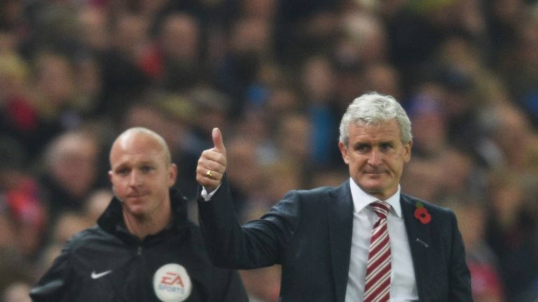 Mark Hughes gestures Stoke's Capital One Cup victory over Chelsea