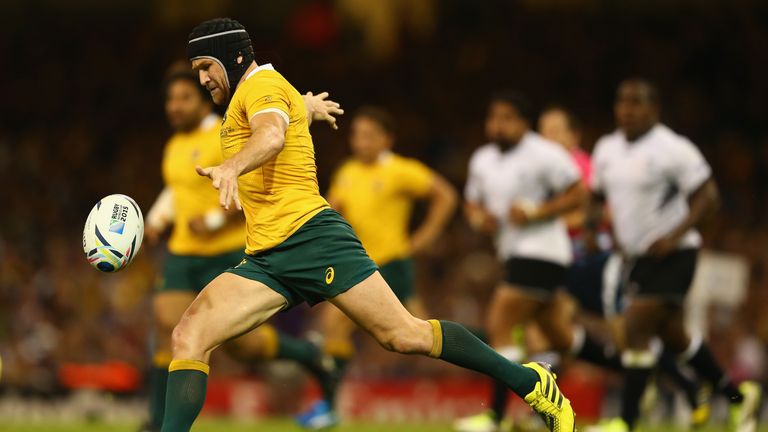 Matt Giteau of Australia kicks for position during the 2015 Rugby World Cup Pool A match between Australia and Fiji 