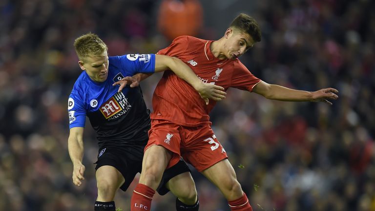 Bournemouth's Matt Ritchie vies with Liverpool's Cameron Brannagan during the English League Cup fourth round football match at Anfield.