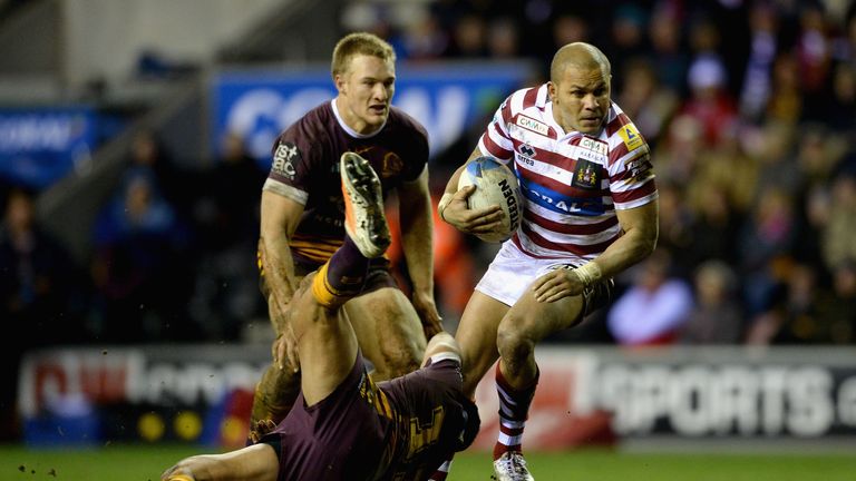 Matty Bowen of Wigan Warriors is tackled by Jordan Kahu of Brisbane Broncos during the World Club Series match between Wigan Warriors and Brisbane Broncos