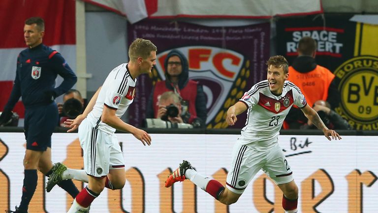 Max Kruse of Germany (23) celebrates with team mate Matthias Ginter as he scores their second goal against Georgia