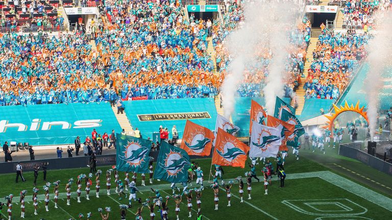 Miami Dolphins players run onto the field prior to the game with New York Jets at Wembley Stadium on October 4, 2015 in Lond