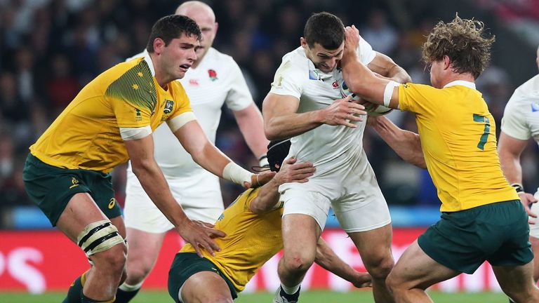 Michael Hooper (No 7) gets to grips with Jonny May during Australia's victory over England at Twickenham