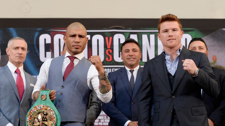 Current WBC champion Miguel Cotto (2nd L) and contender Canelo Alvarez (R) pose during a news conference with Michael Yorkman 