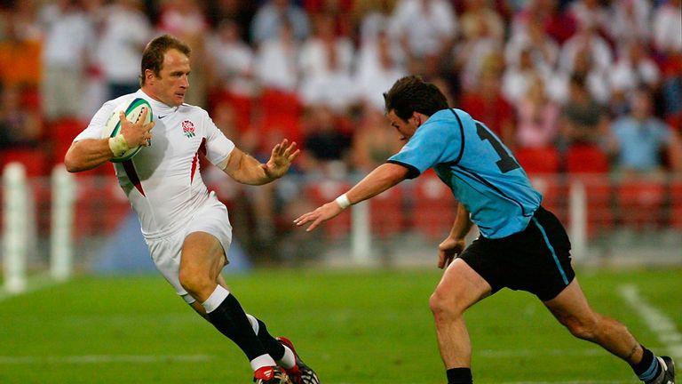 England's Mike Catt runs around the Uruguay defence during the 2003 World Cup