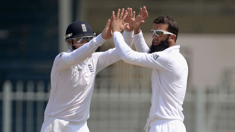 England's Moeen Ali celebrates a wicket with Ian Bell during the tour match against Pakistan A in Sharjah