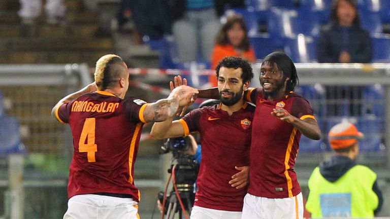 Mohamed Salah (centre) celebrates with AS Roma team-mates Radja Nainggolan and Gervinho  after scoring their third goal against Empoli.  
