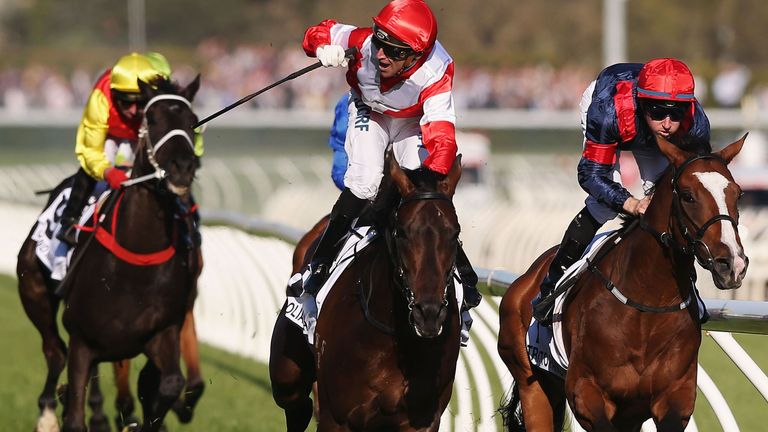 Opie Bosson (C) riding Mongolian Khan wins ahead of Tommy Berry on Trip To Paris (R)