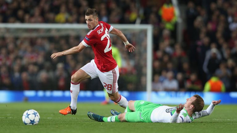 Morgan Schneiderlin of Manchester United in action with Maximilian Arnold of VfL Wolfsburg during the UEFA Champions League Group C match