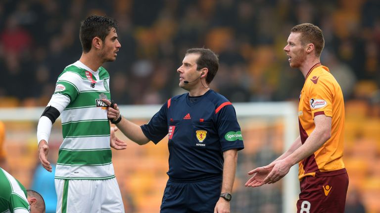 Celtic's Nir Bitton (left) and Motherwell midfielder Stephen Pearson (right) exchange words