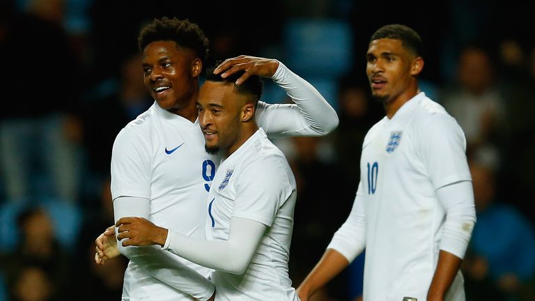 Nathan Redmond (middle) of England is congratulated