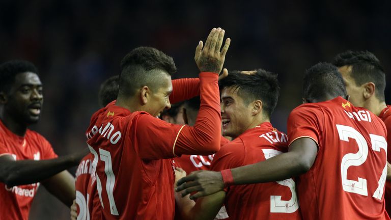 Liverpool players celebrate after Nathaniel Clyne (centre hidden) scores his side's first goal of the game during the Capital One Cup, Fourth Round match
