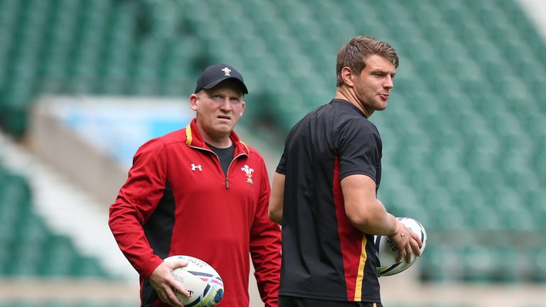 Neil Jenkins (left, with fly-half Dan Biggar) says the quarter -final could go either way