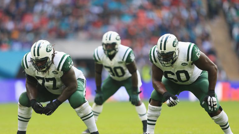 James Carpenter #77 of the New York Jets,  Darrin Walls #30 of the New York Jets and D'Brickashaw Ferguson #60 of the New York Jets