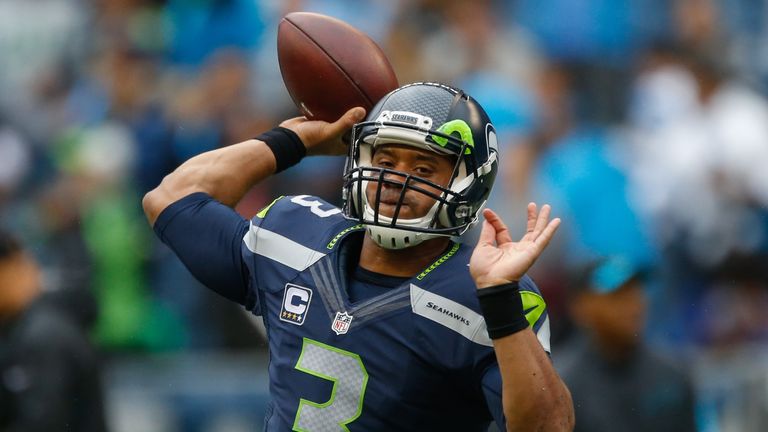 Quarterback Russell Wilson of the Seattle Seahawks warms up prior to the game against the Carolina Panthers at CenturyLink Field