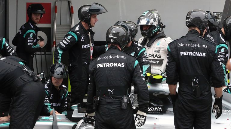 Rosberg gets out of his car after the throttle problem became terminal