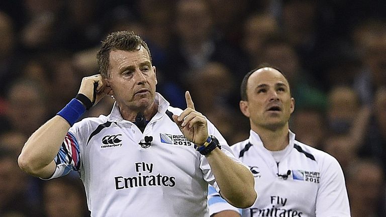 Nigel Owens (left) speaks to the TMO