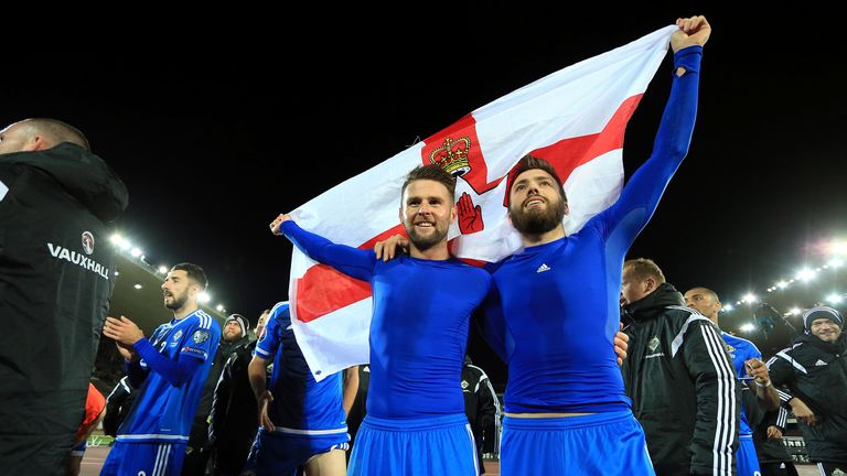 Oliver Norwood and Stuart Dallas celebrate after Northern Ireland's draw with Finland