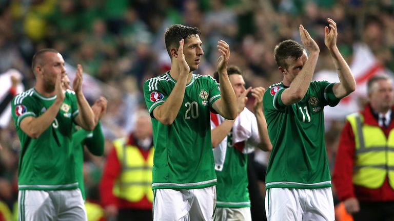 Northern Ireland's Craig Cathcart and Chris Brunt applaud the fans after the final whistle of the UEFA Euro Championship Qualifying match at Windsor Park