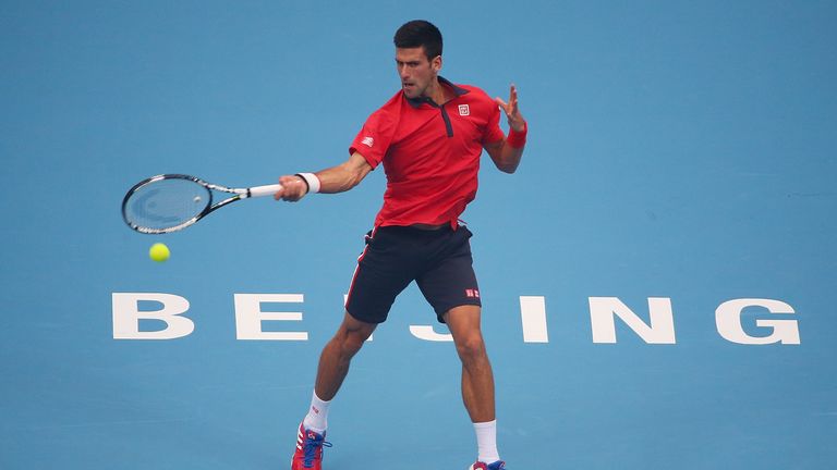 Novak Djokovic of Serbia plays a forehand in his match against Simone Bolelli