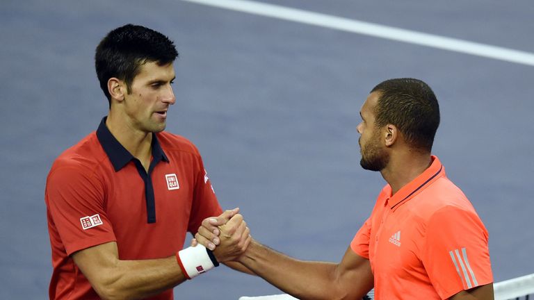 Novak Djokovic (L) celebrates after beating Jo-Wilfried Tsonga (R)