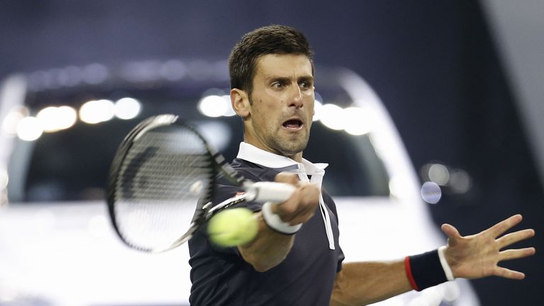 Novak Djokovic of Serbia returns a shot against Martin Klizan of Slovakia during the men's singles second round match on day
