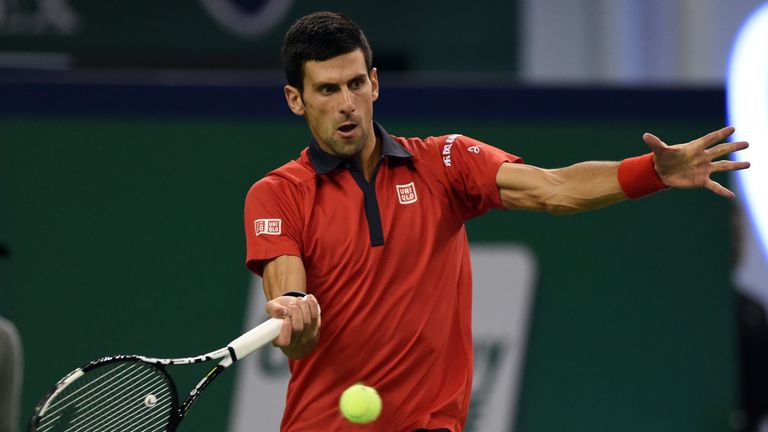 Novak Djokovic of Serbia hits a return during his men's singles semi-final match against Andy Murray of Britain