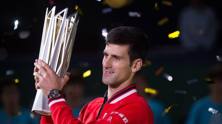 Novak Djokovic holds his trophy