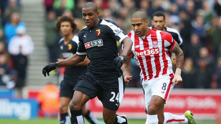 Odion Ighalo of Watford is chased by Stoke's Glen Johnson