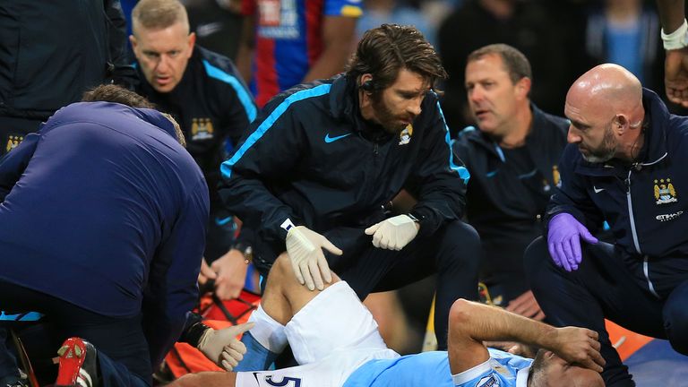 Manchester City's Pablo Zabaleta is treated by medical staff