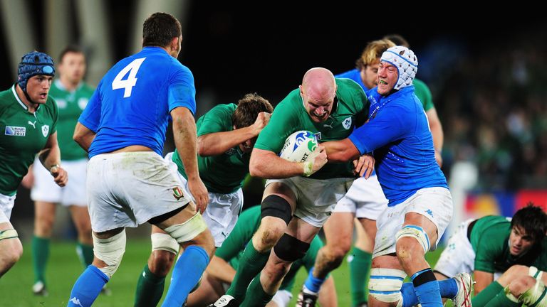 Paul O'Connell of Ireland attempts a run with the ball despite the challenge of Cornelius van Zyl of Italy 