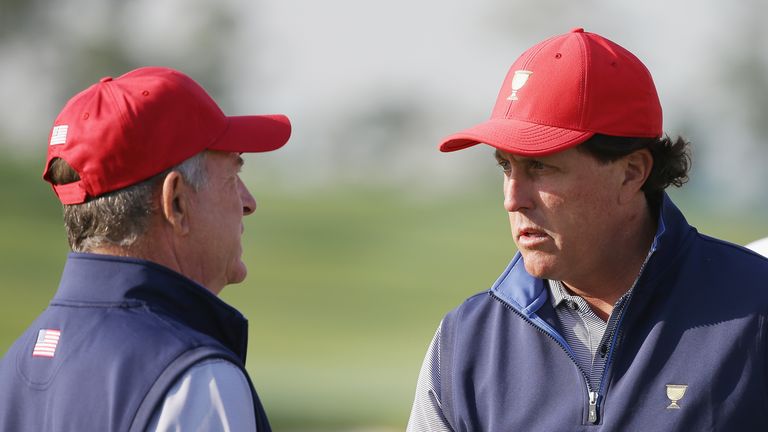 Phil Mickelson (R) chats with United States captain Jay Haas ahead of the Presidents Cup
