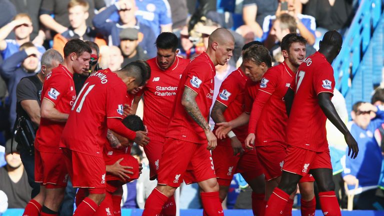 Liverpool's Philippe Coutinho (third left) celebrates his equaliser - just before half-time