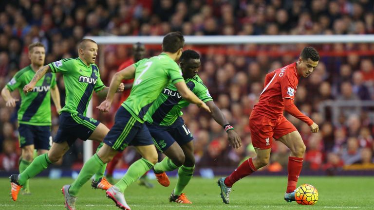 Philippe Coutinho controls the ball against Southampton defense during the Barclays Premier League match between Liverpool and Southampton 