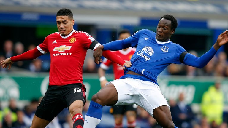 Manchester United's Chris Smalling (left) and Everton's Romelu Lukaku battle for the ball
