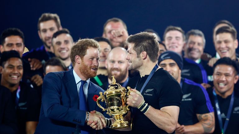Prince Harry presents Richie McCaw with trophy after New Zealand became the first country to win the Rugby World Cup three times