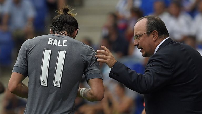 Real Madrid's coach Rafael Benitez (R) gives instructions to Real Madrid's Welsh midfielder Gareth Bale