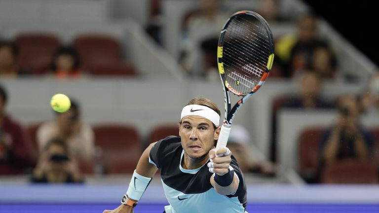 Rafael Nadal of Spain returns a shot against Vasek Pospisil of Canada during the Men's singles Second round match on day five