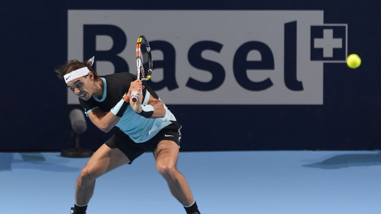 Spanish player Rafael Nadal tries to returns the ball to Czech player Lukas Rosol during the Swiss Indoors