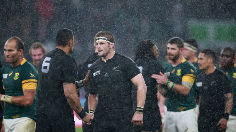 Richie McCaw of the All Blacks shakes hands with Jerome Kaino following the 2015 Rugby World Cup Semi Final match between South Africa and New Zealand