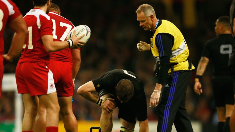 Richie McCaw of New Zealand receives treatment during the match against Georgia