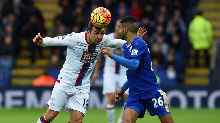 James McArthur of Crystal Palace and Riyad Mahrez of Leicester City compete for the ball 