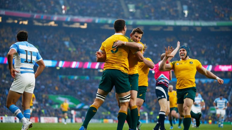LONDON, ENGLAND - OCTOBER 25:  Rob Simmons (l) celebrates with Bernard Foley of Australia after scoring the opening try during the 2015 Rugby World Cup Sem
