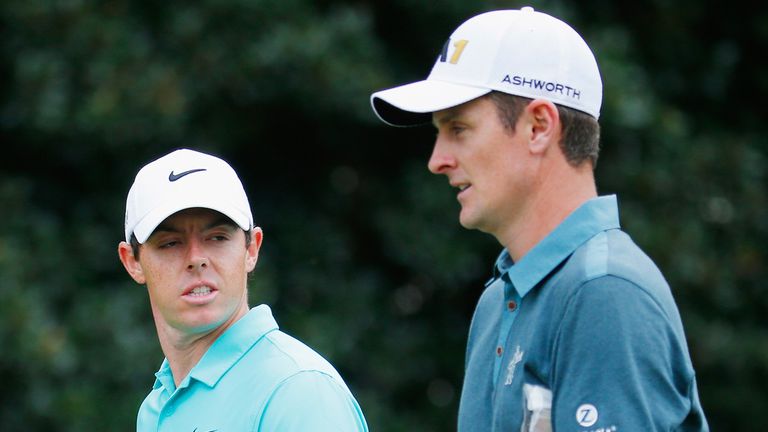 ATLANTA, GA - SEPTEMBER 24:   Rory McIlroy of Northern Ireland (L) and Justin Rose of England walk together on the fifth hole during the first round of the
