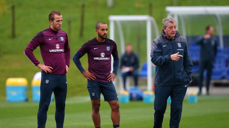England manager Roy Hodgson (right) talks with his players as Harry Kane (left) and Theo Walcott (centre) look on during training