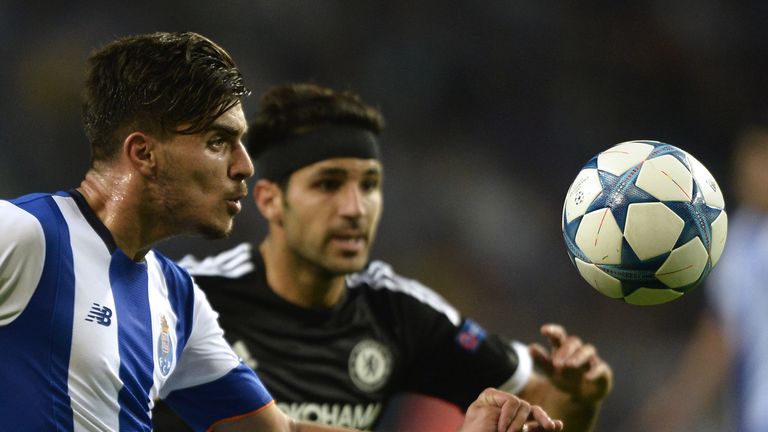 Porto's midfielder Ruben Neves (L) vies with Chelsea's Spanish midfielder Cesc Fabregas 